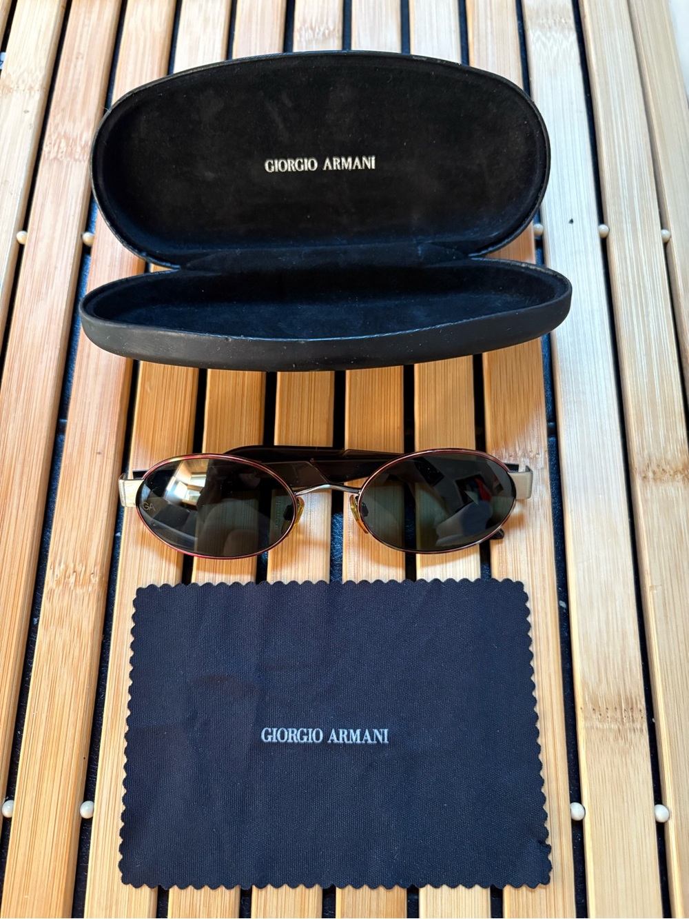 Giorgio Armani Oval Sunglasses with tortoise like front frame and metal sides